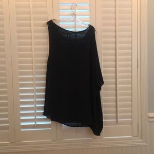 Sleeveless tunic with cascading left side